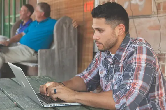 Man working on a laptop.
